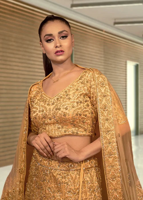 Golden heavy traditional lehenga in kaftan silk