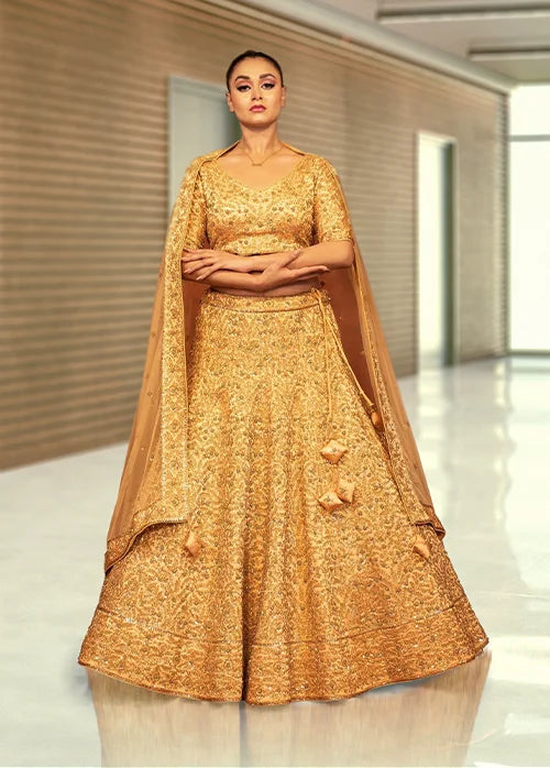Golden heavy traditional lehenga in kaftan silk
