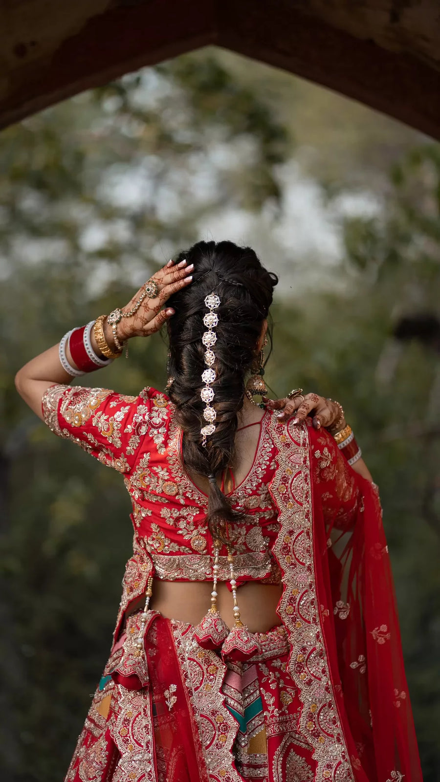 Traditional tomato red lehenga in Jodhpuri style