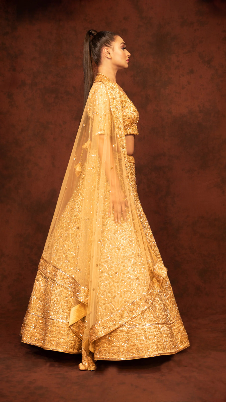 Golden heavy traditional lehenga in kaftan silk