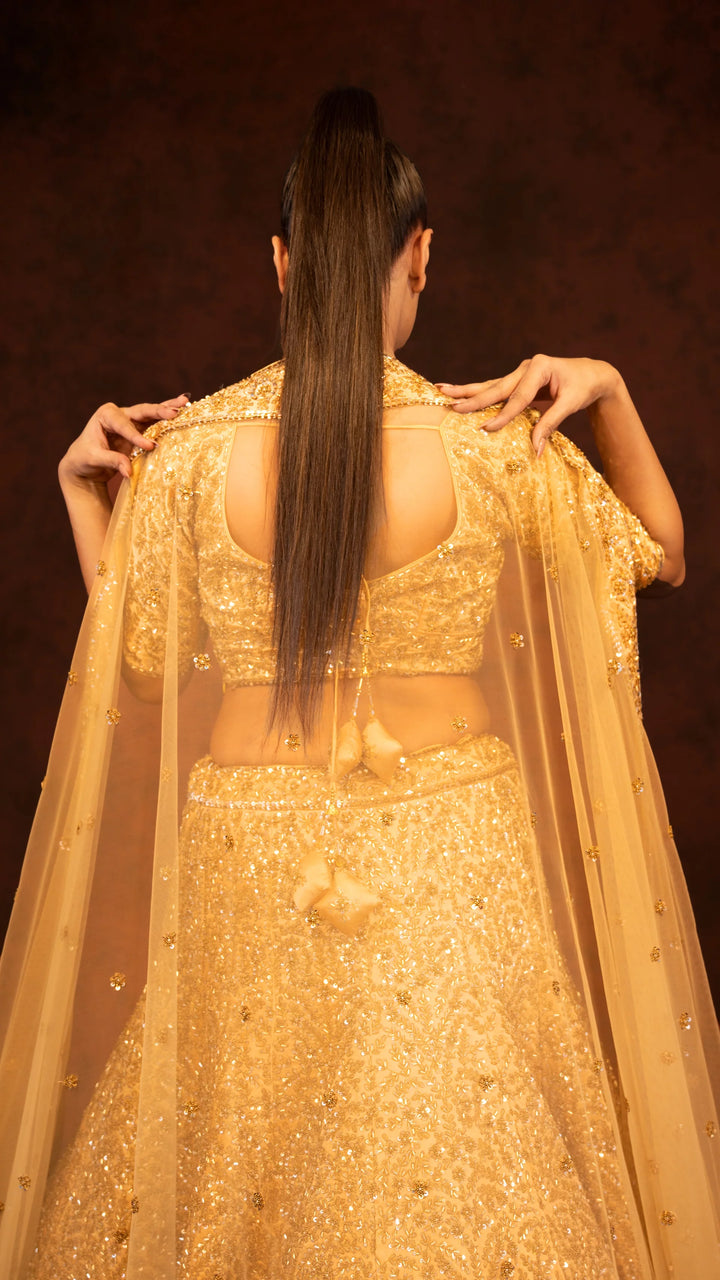 Golden heavy traditional lehenga in kaftan silk