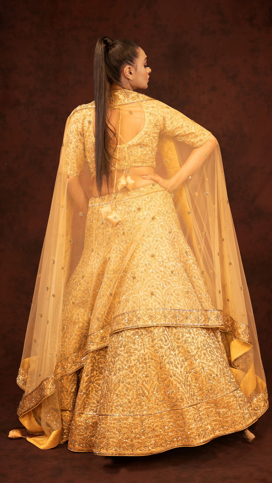 Golden heavy traditional lehenga in kaftan silk