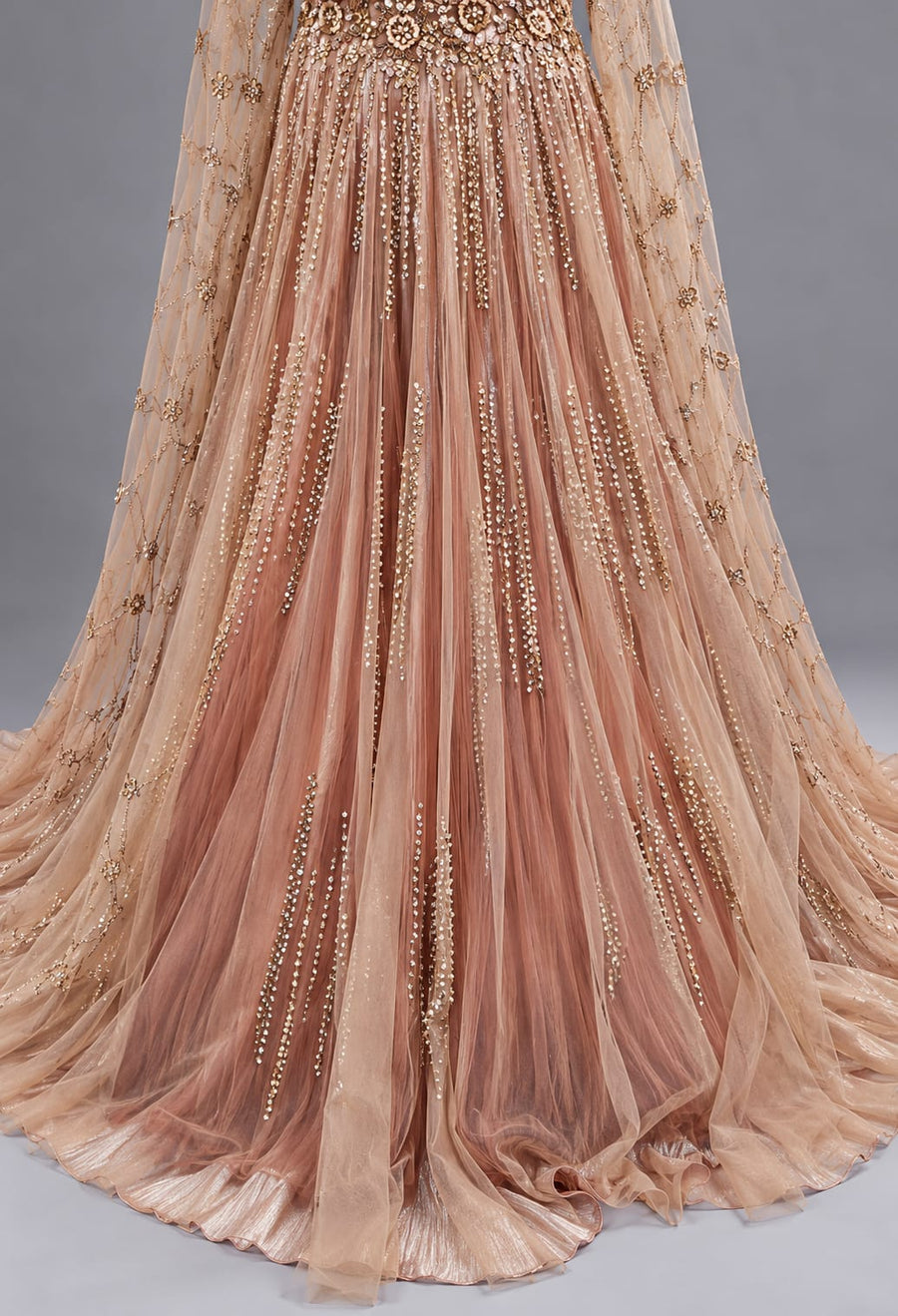 Rose Gold Designer Net Gown with Sequin Work and Cape Sleeves