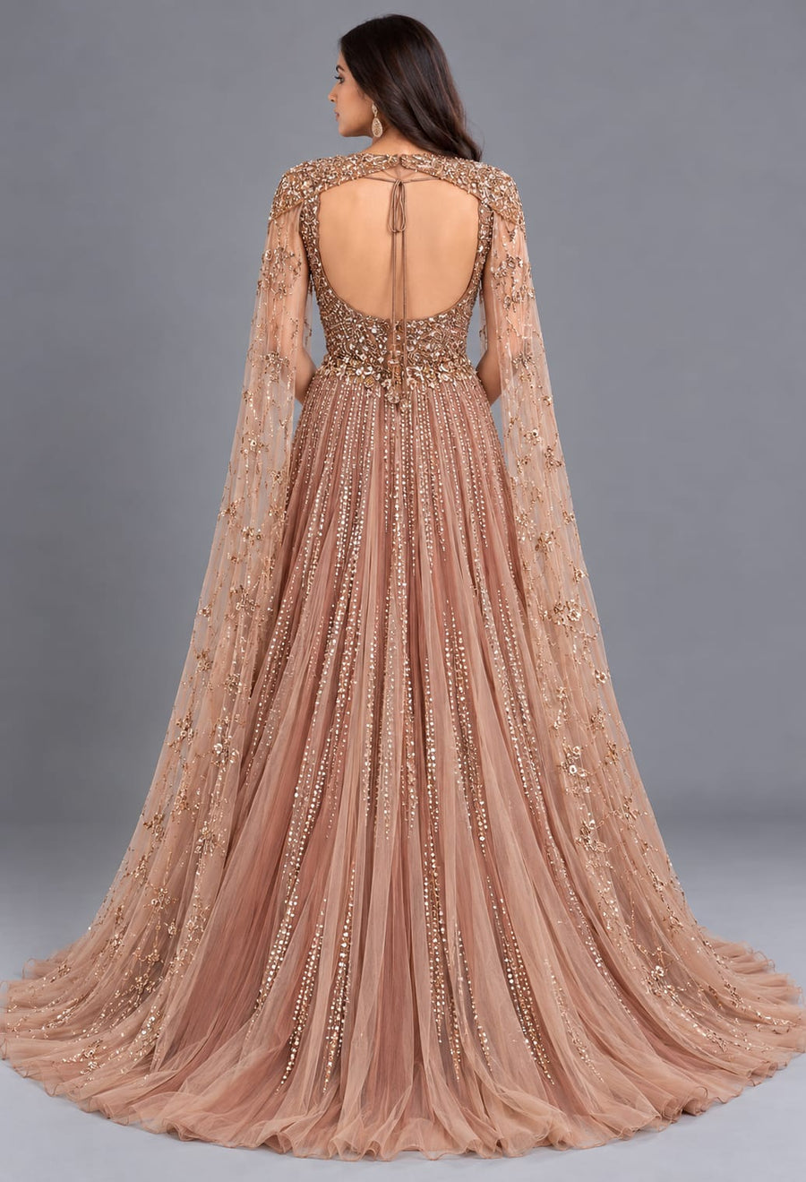 Rose Gold Designer Net Gown with Sequin Work and Cape Sleeves