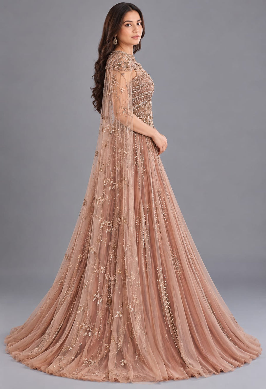 Rose Gold Designer Net Gown with Sequin Work and Cape Sleeves