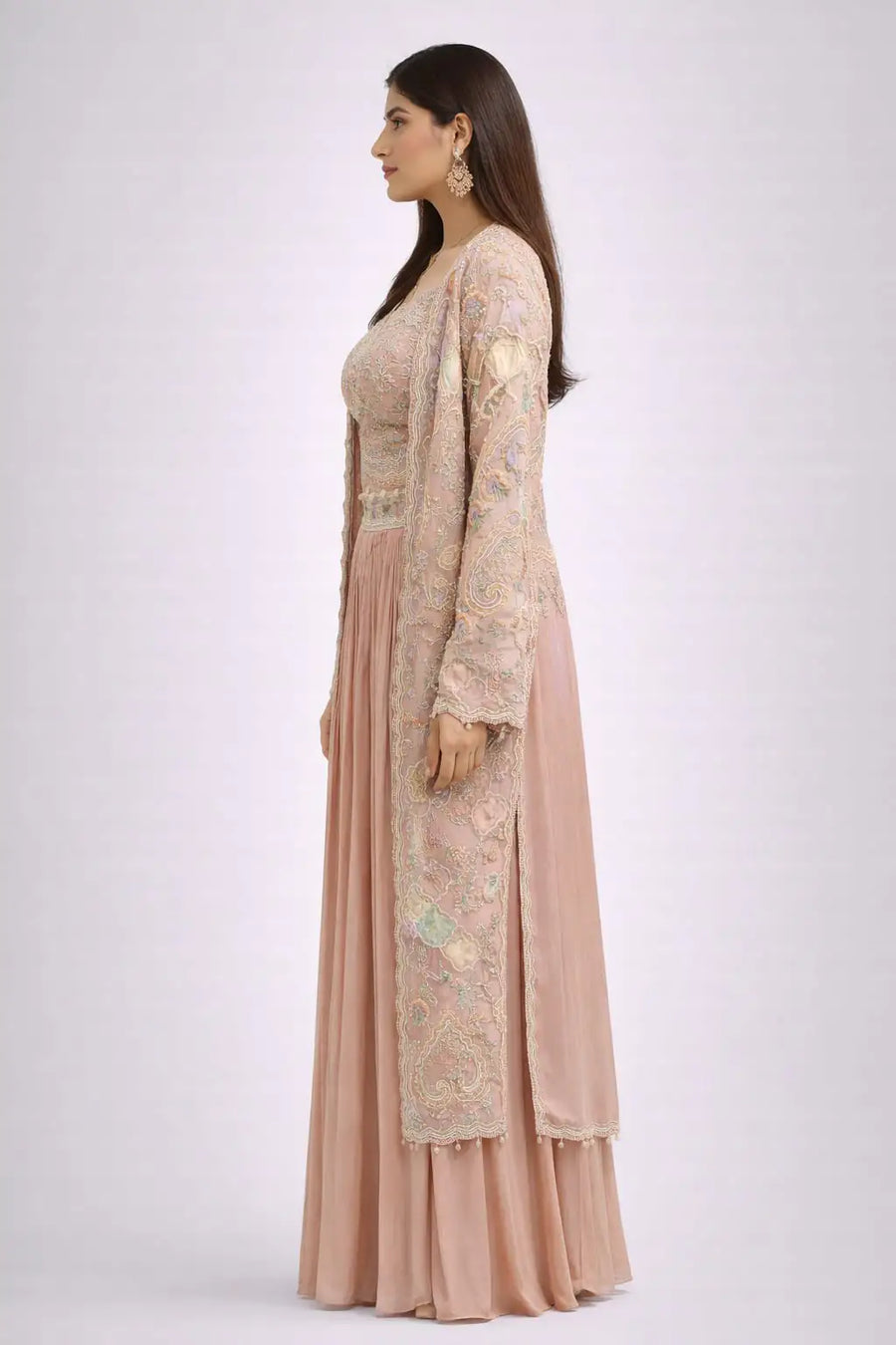 long embroidered jacket and pink skirt