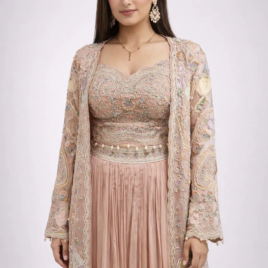 long embroidered jacket and pink skirt