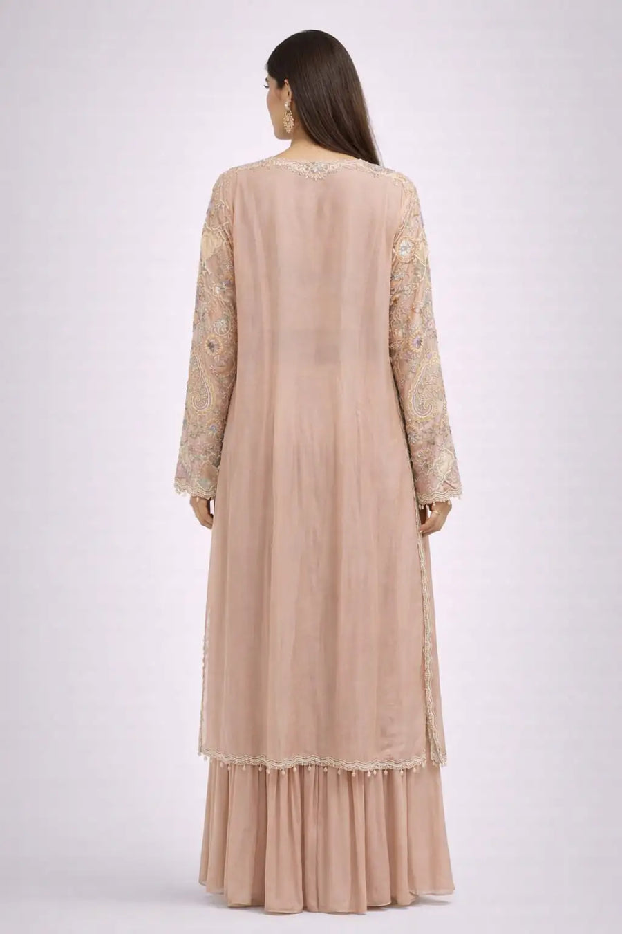 long embroidered jacket and pink skirt