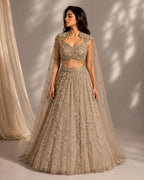 gold embellished cape gown