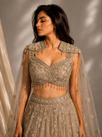 gold embellished cape gown