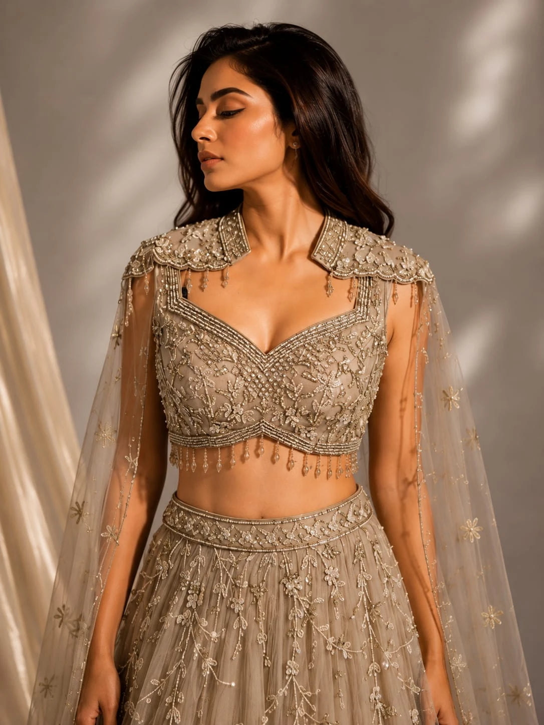 gold embellished cape gown