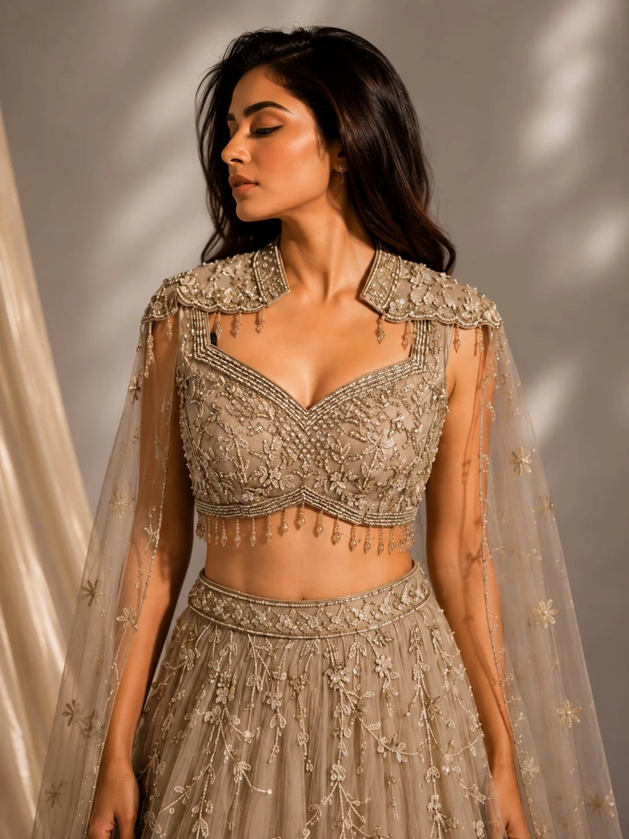 gold embellished cape gown