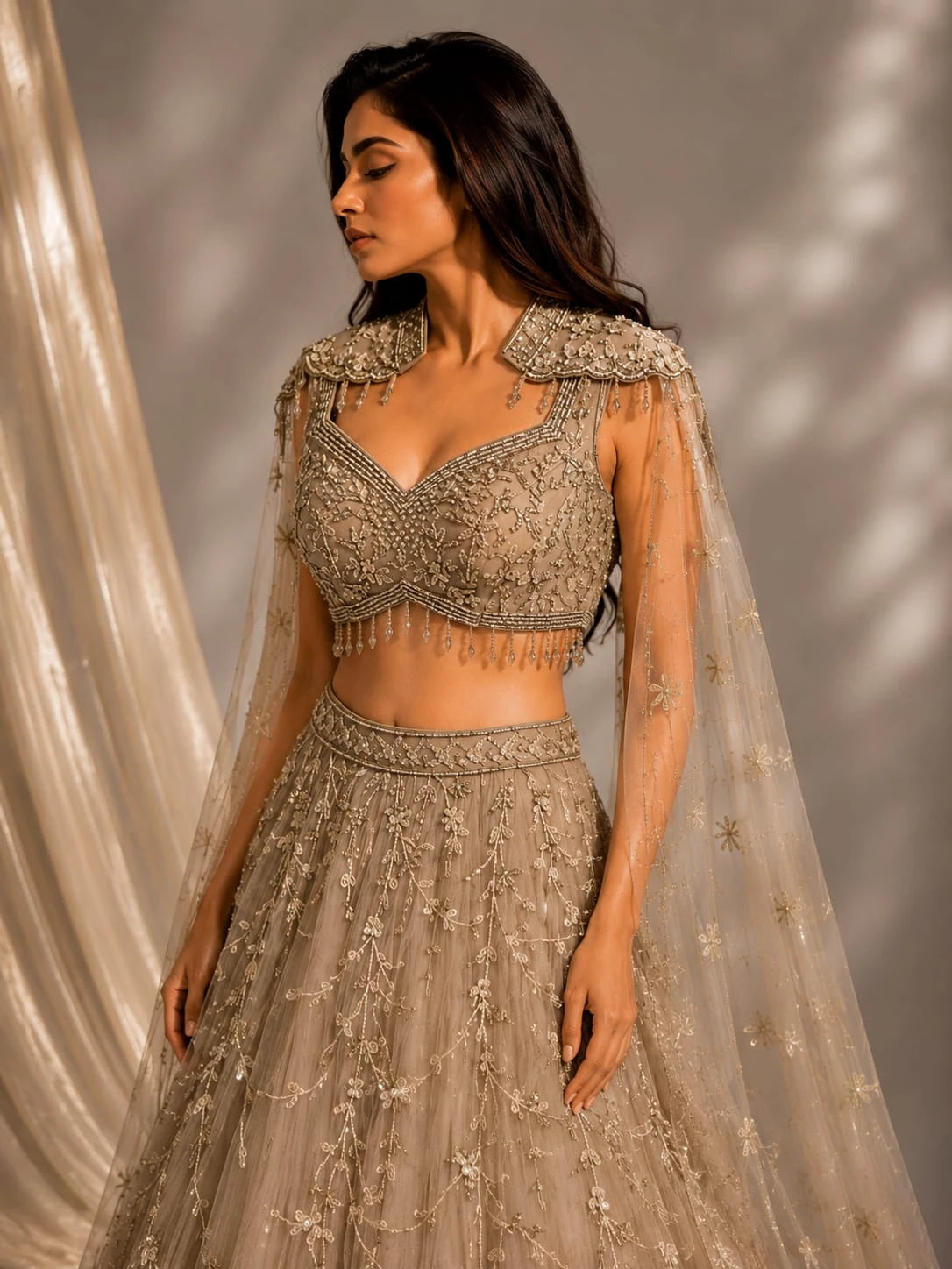 gold embellished cape gown