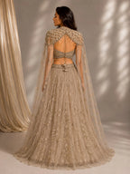 gold embellished cape gown