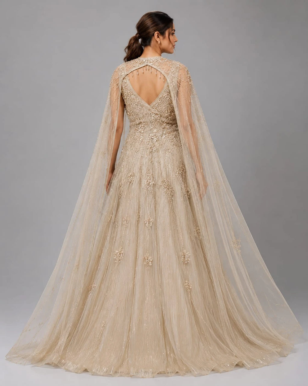 gold cape sleeve gown