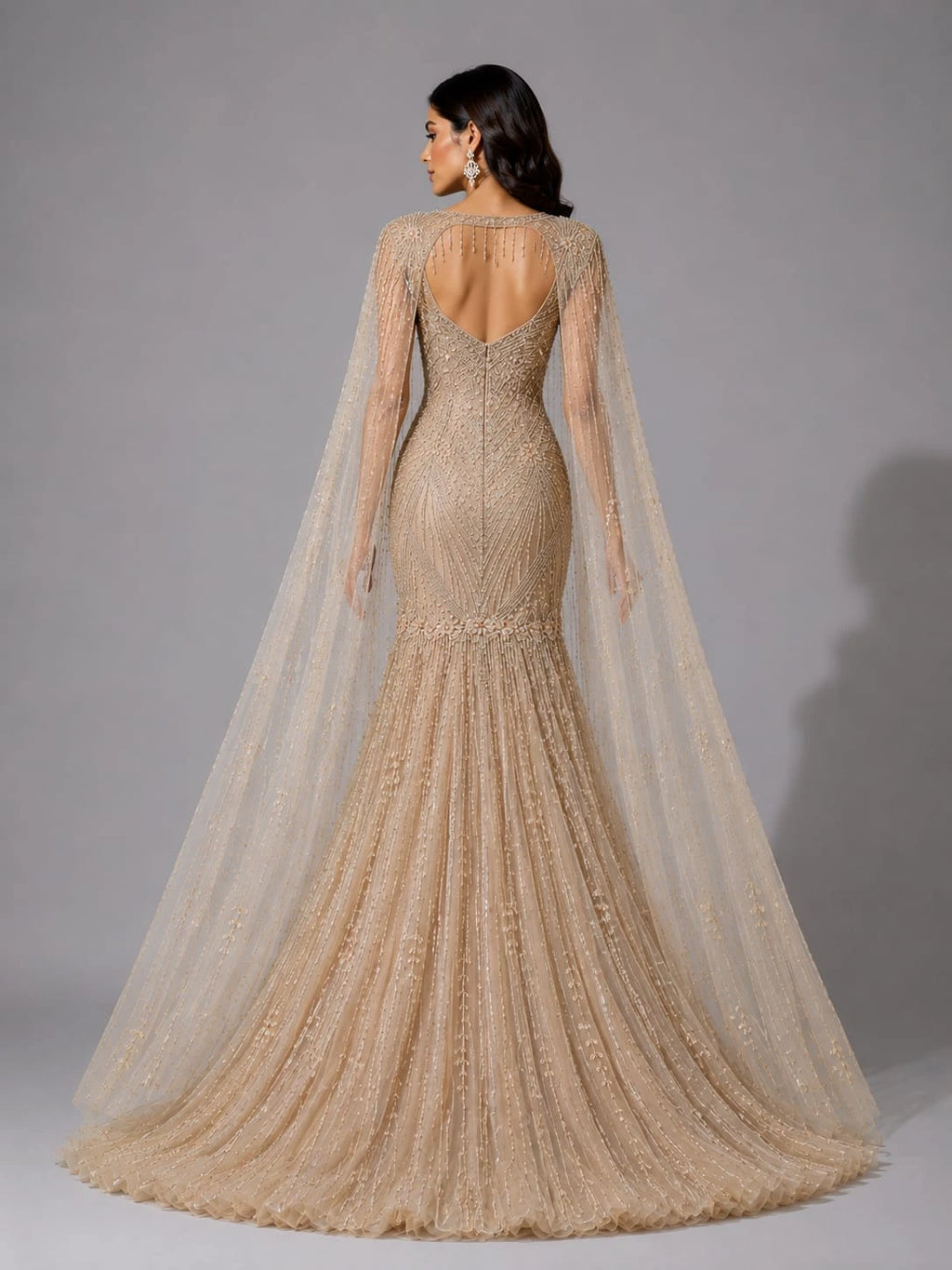 golden cape sleeve gown