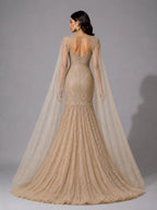 golden cape sleeve gown