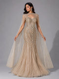 golden cape sleeve gown