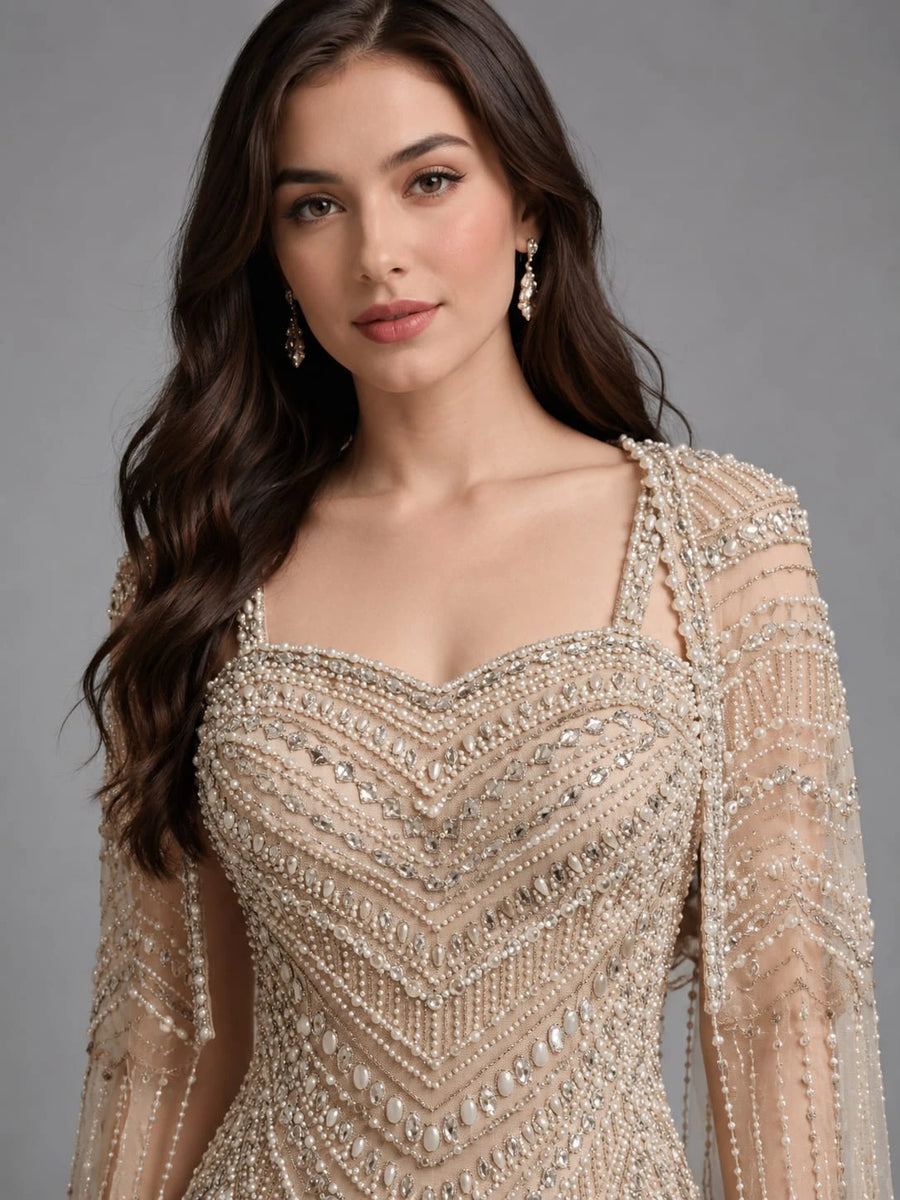 cream cape gown