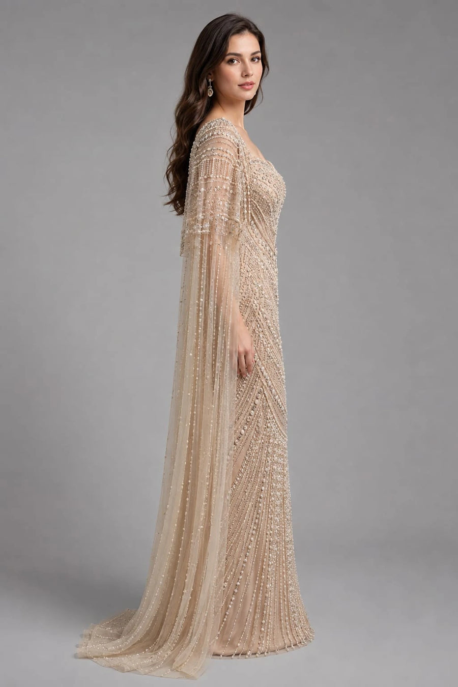 cream cape gown
